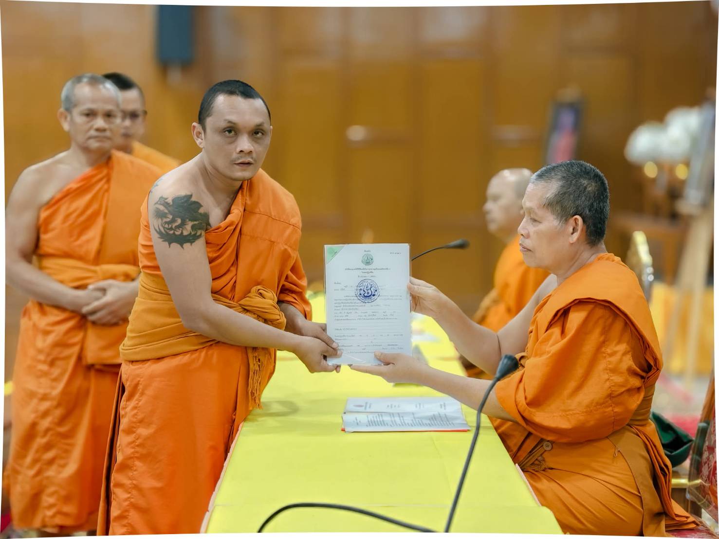title - วันเสาร์ที่ 25 กรกฎาคม 2569 นายประเสริฐ กาญจนเกียรติกุล ปฏิรูปที่ดินจังหวัดบุรีรัมย์ พร้อมด้วยเจ้าหน้าที่ ส.ป.ก.บุรีรัมย์ มอบหนังสืออนุญาตให้ใช้ที่ดินเพื่อกิจการสาธารณูปโภค กรณีสำนักงานพระพุทธศาสนาแห่งชาติขอใช้ที่ดินเพื่อสร้างวัดจำนวน 7 วัด ในการประชุมคณะสงฆ์จังหวัดบุรีรัมย์ สมัยสามัญ ครั้งที่ 5 ปี 2569 ณ วัดกลาง พระอารามหลวง อำเภอเมืองบุรีรัมย์ จังหวัดบุรีรัมย์